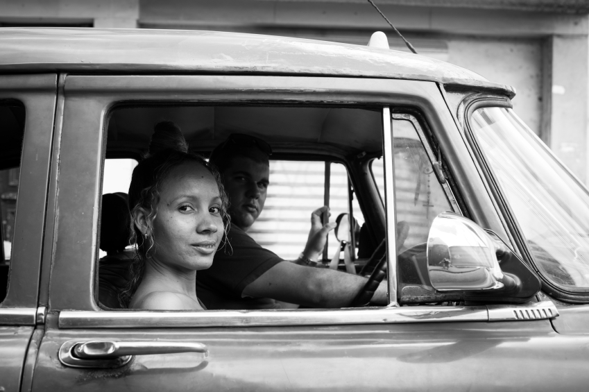 Taxi driver and passenger in Havana, Cuba